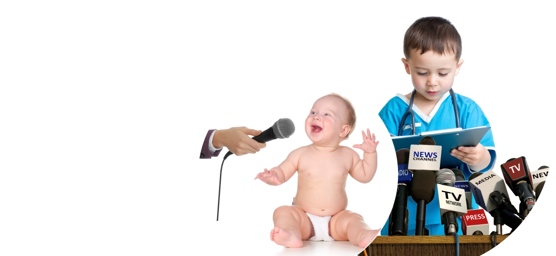 baby talking on a microphone, boy reading a press release